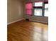 Bright bedroom with hardwood floors, ample natural light, and modern window treatments at 8542 W 10Th W Ave, Lakewood, CO 80215