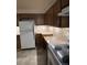 Efficient kitchen featuring ample cabinet space, tile backsplash, and modern appliances at 8542 W 10Th W Ave, Lakewood, CO 80215