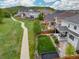 Aerial view of landscaped yards behind a residential area and a walking path at 3319 Starry Night Loop, Castle Rock, CO 80109