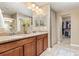 This bathroom boasts double sinks, granite countertops, and a convenient walk-in closet at 3319 Starry Night Loop, Castle Rock, CO 80109