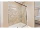 This bathroom showcases a glass enclosed shower with decorative tiling and modern fixtures at 3319 Starry Night Loop, Castle Rock, CO 80109