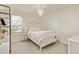 This bedroom offers ample natural light and showcases a stylish chandelier lighting fixture at 3319 Starry Night Loop, Castle Rock, CO 80109