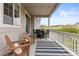 Covered porch features seating, outdoor rug, and great views of the neighborhood at 3319 Starry Night Loop, Castle Rock, CO 80109