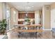 Inviting dining area with unique light fixture, wood floors and access to the kitchen at 3319 Starry Night Loop, Castle Rock, CO 80109