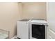 This laundry room features a front loading washer and dryer, with overhead hanging capabilities at 3319 Starry Night Loop, Castle Rock, CO 80109