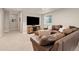 Inviting living room features a plush sectional sofa, entertainment center, and natural light at 3319 Starry Night Loop, Castle Rock, CO 80109