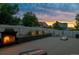 Backyard patio featuring a built-in fireplace, comfortable seating, lawn games, and a privacy fence at 3540 Brushwood Dr, Castle Rock, CO 80109