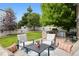 Cozy backyard with a wood deck, outdoor kitchen, grill, and seating area for relaxation and entertainment at 3540 Brushwood Dr, Castle Rock, CO 80109