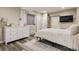 Bedroom with a gray rug, dresser, large window and double-door closet at 3540 Brushwood Dr, Castle Rock, CO 80109