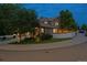 Attractive house with a white picket fence, a large tree, and an American flag at 3540 Brushwood Dr, Castle Rock, CO 80109