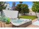 Hot tub with flowers and backyard at 3540 Brushwood Dr, Castle Rock, CO 80109