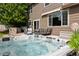 Backyard featuring a relaxing hot tub, outdoor kitchen, and comfortable seating, perfect for leisure at 3540 Brushwood Dr, Castle Rock, CO 80109