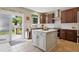 Bright kitchen with island, stainless appliances, and a sliding door access to the backyard patio at 3540 Brushwood Dr, Castle Rock, CO 80109