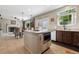 Eat-in kitchen features a center island, stainless steel appliances, breakfast bar and granite countertops at 3540 Brushwood Dr, Castle Rock, CO 80109