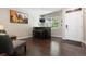 Comfortable den with bar and stools with a TV and natural light at 3540 Brushwood Dr, Castle Rock, CO 80109