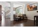 Cozy living room with wood floors, gray walls, and a bay window at 3540 Brushwood Dr, Castle Rock, CO 80109