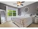 Bedroom with ceiling fan, queen size bed, and bright window at 3540 Brushwood Dr, Castle Rock, CO 80109