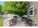 Outdoor kitchen with stone countertop, grill, and mini-fridge, perfect for summer entertaining in the backyard at 3540 Brushwood Dr, Castle Rock, CO 80109