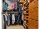 Organized walk-in closet featuring hanging racks, shelves, and drawers for optimal storage at 3540 Brushwood Dr, Castle Rock, CO 80109