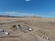 Vast landscape features a home with outbuildings and rolling hills, surrounded by open grasslands at 11810 Mesa View Rd, Larkspur, CO 80118