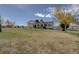Expansive backyard featuring a screened-in porch with hot tub and ample space for outdoor activities at 11810 Mesa View Rd, Larkspur, CO 80118