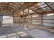 Interior view of a functional barn with stalls and ample space for livestock or storage at 11810 Mesa View Rd, Larkspur, CO 80118
