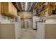 Utility basement area featuring washer, dryer, water heater and other utilities at 11810 Mesa View Rd, Larkspur, CO 80118