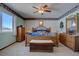Cozy bedroom with carpet, traditional decor, and wooden furnishings at 11810 Mesa View Rd, Larkspur, CO 80118