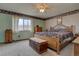 Bedroom featuring carpet, traditional decor, and a bright window at 11810 Mesa View Rd, Larkspur, CO 80118