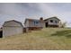 Charming home with stone accents and a spacious shed, perfect for storage and hobbies at 11810 Mesa View Rd, Larkspur, CO 80118