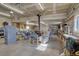 Spacious garage with ample space for projects, storage, and a comfortable seating area at 11810 Mesa View Rd, Larkspur, CO 80118