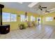 Bright room with natural light, tile flooring, a pellet stove, and mountain views at 11810 Mesa View Rd, Larkspur, CO 80118