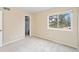 Bright bedroom with neutral walls, gray carpet, and closet at 7999 Chase Cir # 31, Arvada, CO 80003