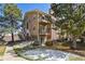 A view of the exterior of this 3 story condo with patios and a brick chimney at 3051 S Ursula Cir # 302, Aurora, CO 80014