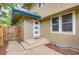 Inviting front entrance with covered porch and well-maintained landscaping, great natural light from windows at 8759 E Roundtree Ave, Greenwood Village, CO 80111