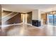 Bright living room with wood floors, fireplace, and staircase; ideal for Gathering time and gatherings at 8759 E Roundtree Ave, Greenwood Village, CO 80111