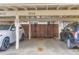 Assigned parking area with covered parking, unit number 8759, and a wooden fence that encloses the back patio at 8759 E Roundtree Ave, Greenwood Village, CO 80111