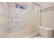 A renovated bathroom featuring a tub, shower and toilet at 8759 E Roundtree Ave, Greenwood Village, CO 80111