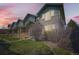 Exterior view of townhomes featuring well-maintained landscaping at 552 S Mobile Pl, Aurora, CO 80017