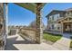 Charming front porch boasts stone column and well-maintained landscaping at 552 S Mobile Pl, Aurora, CO 80017