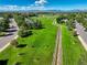 Aerial view of a community featuring green spaces, parks, and walking paths, perfect for outdoor recreation at 1413 Ben Nevis Ave, Broomfield, CO 80020