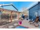Back patio with arbor, grill, and seating offering a serene outdoor space at 1413 Ben Nevis Ave, Broomfield, CO 80020