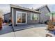 Backyard patio with a grill, outdoor furniture, and easy access to the house at 1413 Ben Nevis Ave, Broomfield, CO 80020
