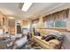 Relaxing basement area with comfortable seating and ample natural light at 1413 Ben Nevis Ave, Broomfield, CO 80020