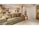 Basement area features comfortable sofa with bar and workout area at 1413 Ben Nevis Ave, Broomfield, CO 80020