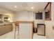 Finished basement offers a bar and lounge area with modern features at 1413 Ben Nevis Ave, Broomfield, CO 80020