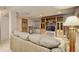 Spacious basement features built-in shelving and comfortable seating at 1413 Ben Nevis Ave, Broomfield, CO 80020