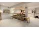 Finished basement with plush carpeting, neutral tones, and wet bar at 1413 Ben Nevis Ave, Broomfield, CO 80020