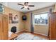Bedroom features a large window for ample natural light and hardwood floors at 1413 Ben Nevis Ave, Broomfield, CO 80020