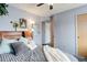 Comfortable bedroom with plush bedding and decor with view to the ensuite bathroom at 1413 Ben Nevis Ave, Broomfield, CO 80020